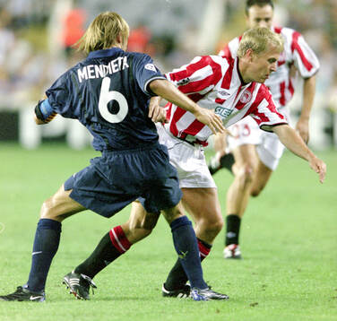 Par Zetterberg of Olympiacos against Gaizka Mendieta of