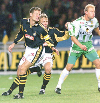 AIK:s Michael Brundin och Erik Edman mot Hammarbys Andreas