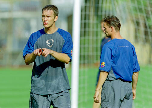 Patrik Andersson of Barcelona. Right Marc Overmars