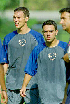 Patrik Andersson and Xavi of Barcelona