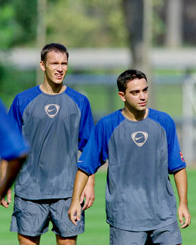 Patrik Andersson and Xavi of Barcelona