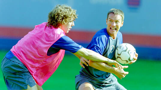 Carles Puyol and Patrik Andersson of Barcelona