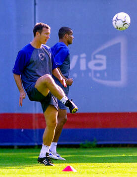 Patrik Andersson of Barcelona. In background Rivaldo