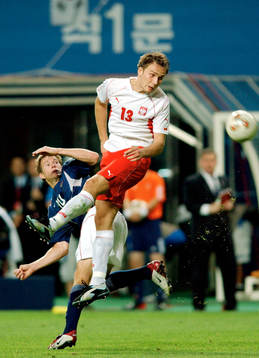 Arkadiuz Glowacki, Polen och Brian McBride, USA