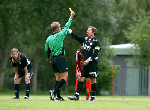Domare, gult kort, varning