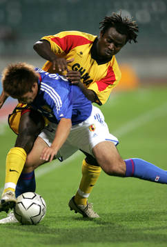 Rasak Pimpong, uganda och Yuichi Komano, Japan