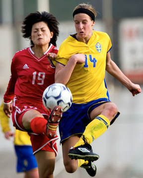 Sverige - Kina. Maria Karlsson och Wang Jian