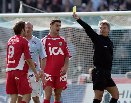 Domare, gult kort, varning