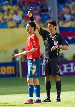 Domare, gult kort, varning. Luis Garcia, Spanien
