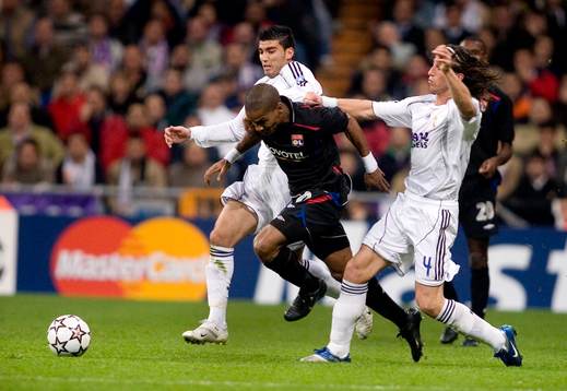 Florent Malouda, Lyon och Guti och Sergio Ramos, Real Madrid