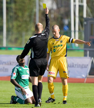 Domare, gult kort, varning