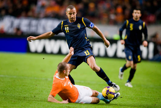 Henrik Larsson, Sverige och John Heitinga, Holland
