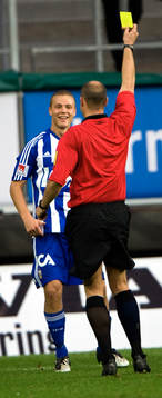 Domare, gult kort, varning