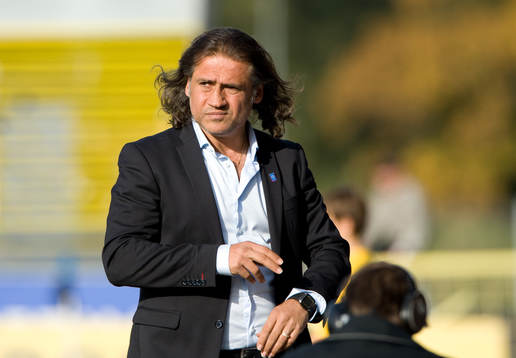 Özcan Melkemichel, tränare