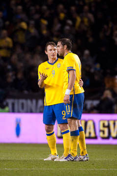 Kim Källström, och Johan Elmander, Sverige