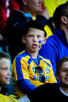 Supporter, fan, pojke på läktaren
