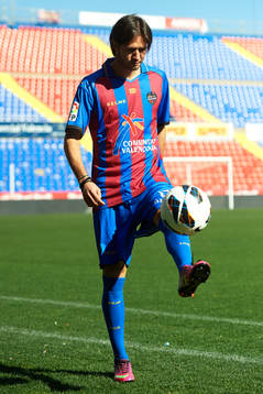 Robert Aquafresca poses with the ball at the new signing of