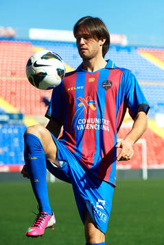 Robert Aquafresca poses with the ball at the new signing of