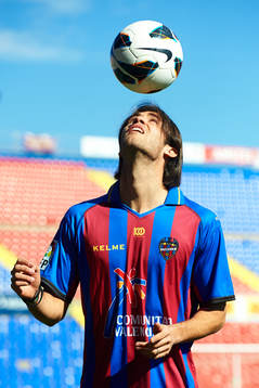 Robert Aquafresca poses with the ball at the new signing of
