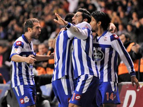 Riki celebrating his goal- with Pizzi, Abel Aguilar and