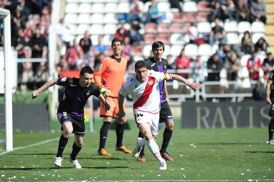 player Rayo Vallecano Foward Piti (10) with Player Real