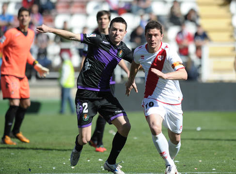 player Rayo Vallecano Foward Piti (10) with Player Real