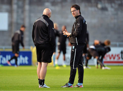 Malmö manager Rikard Norling, right, speaking to chief