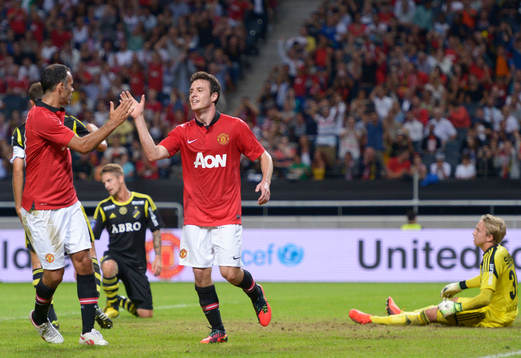 Manchester Uniteds Ryan Giggs och Ángelo Henríquez jublar