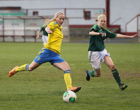 Sweden's Kosovare Asllani and Northern Ireland's Nadene