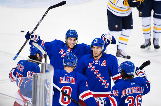 New Yorks Benoit Pouliot (t v) jublar