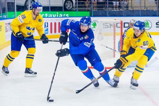 Sveriges Dick Axelsson och Mikael Backlund jagar Italiens