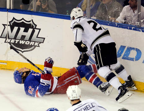 New York Rangers left wing Carl Hagelin (62) is knocked to