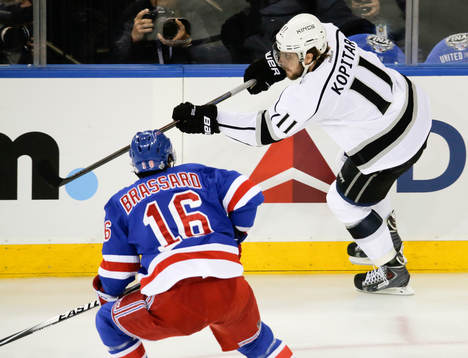Los Angeles Kings center Anze Kopitar (11) skates past New