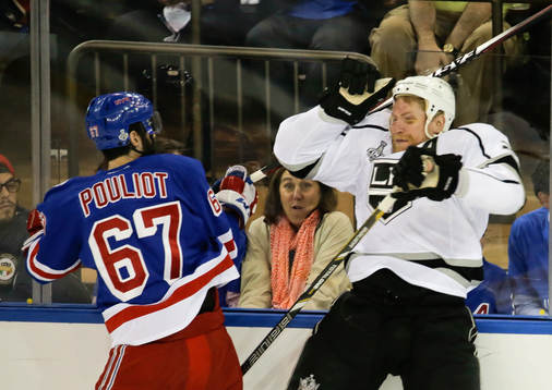 New York Rangers left wing Benoit Pouliot (67) checks Los
