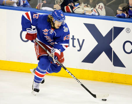 New York Rangers left wing Carl Hagelin (62) carries the