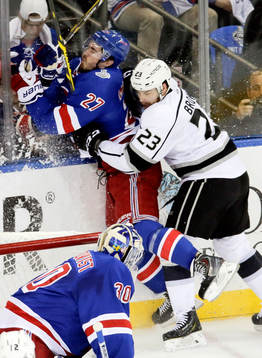 Los Angeles Kings right wing Dustin Brown (23) checks New