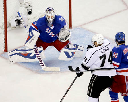 New York Rangers goalie Henrik Lundqvist (30) gloves a shot