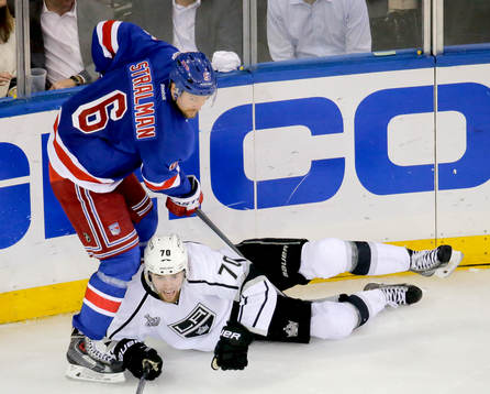 New York Rangers defenseman Anton Stralman (6) knocks Los