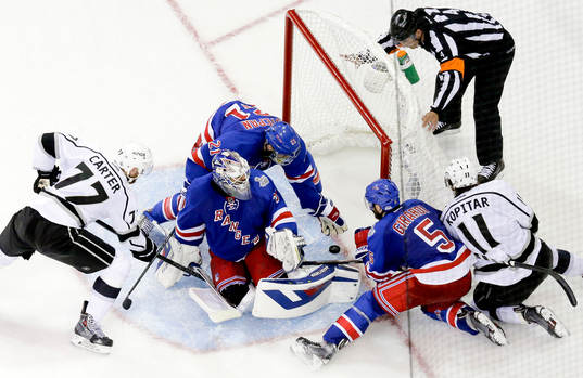 New York Rangers center Derek Stepan (21) reaches to stop a
