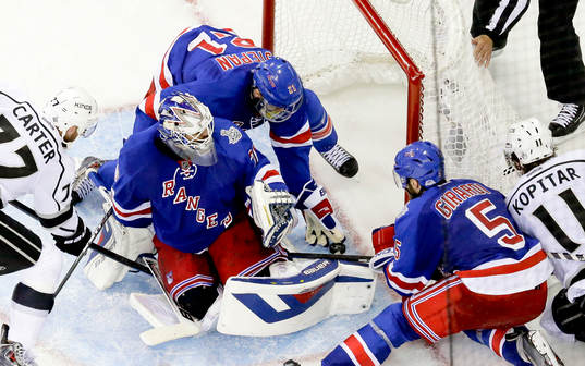 New York Rangers center Derek Stepan (21) reaches to stop a