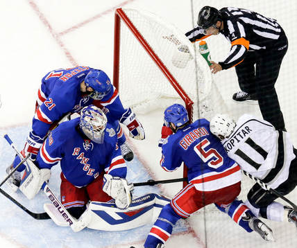 New York Rangers center Derek Stepan (21) reaches to stop a