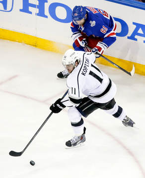 Los Angeles Kings center Anze Kopitar (11) takes the puck
