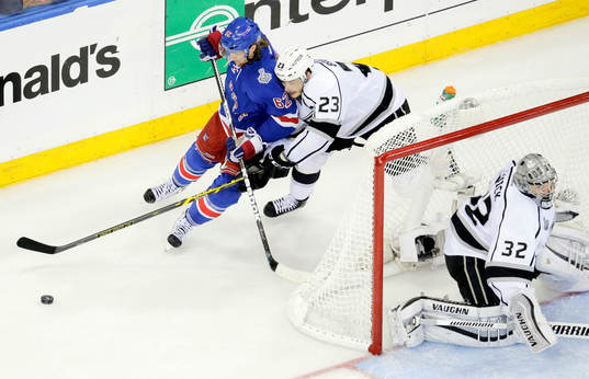 New York Rangers left wing Carl Hagelin (62) carries the