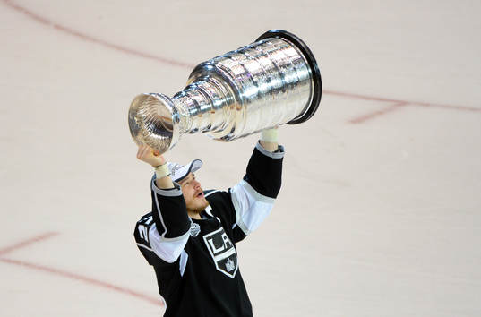 Dustin Brown of the Los Angeles Kings lifts the Stanley Cup