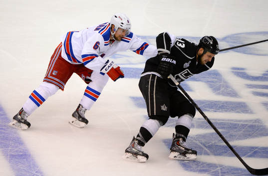 Anton Stralman of the New York Rangers chases Kyle Clifford