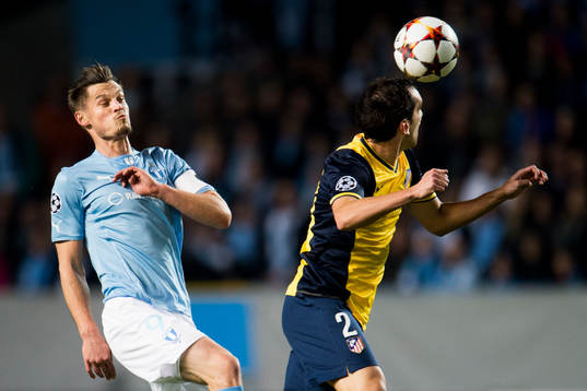 s Markus Rosenberg och Atletico Madrids Diego Godin