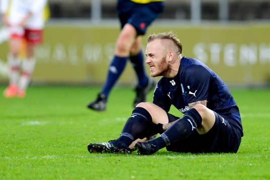 Malmö FFs Magnus Eriksson grinar illa