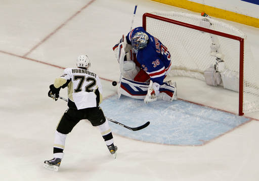 New York Rangers goalie Henrik Lundqvist makes a save