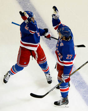New York Rangers Ryan McDonagh (R) celebrates with teammate