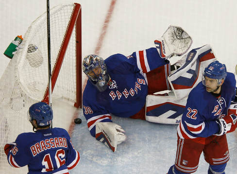 New York Rangers goalie Henrik Lundqvist (C) lays